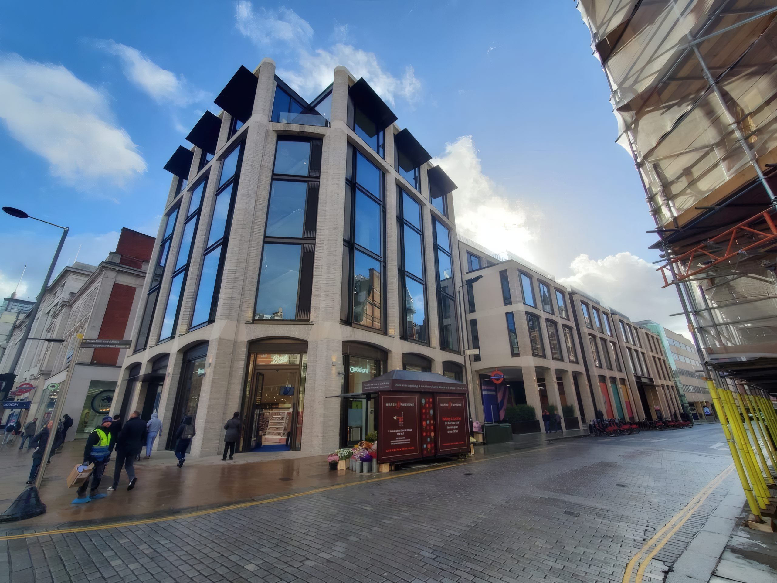 The stone and glass corner of the Kensington High Street development, London.