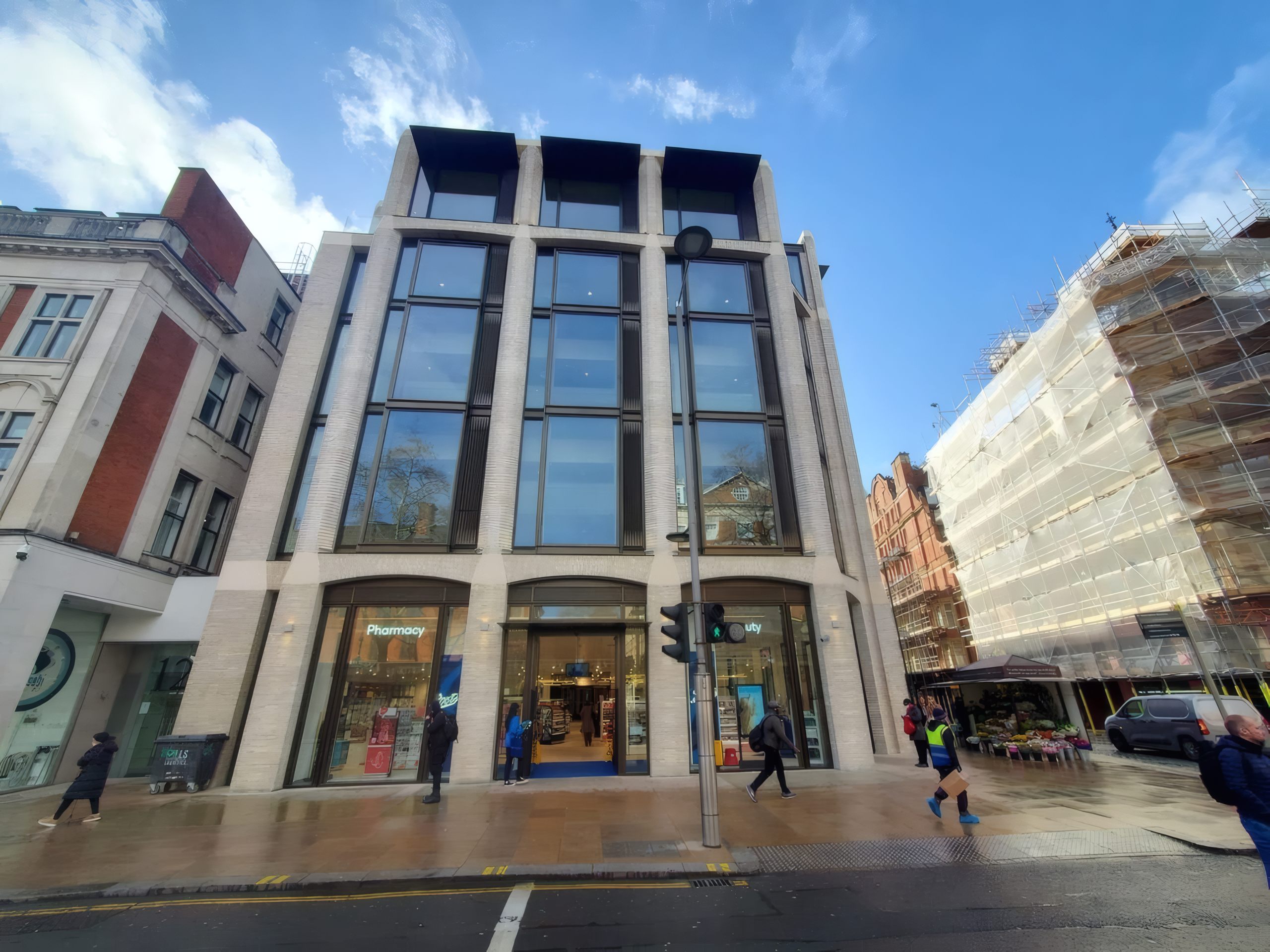 The Kensington High Street development, London, with the aluminium-clad roof pavilions above its stone facade.