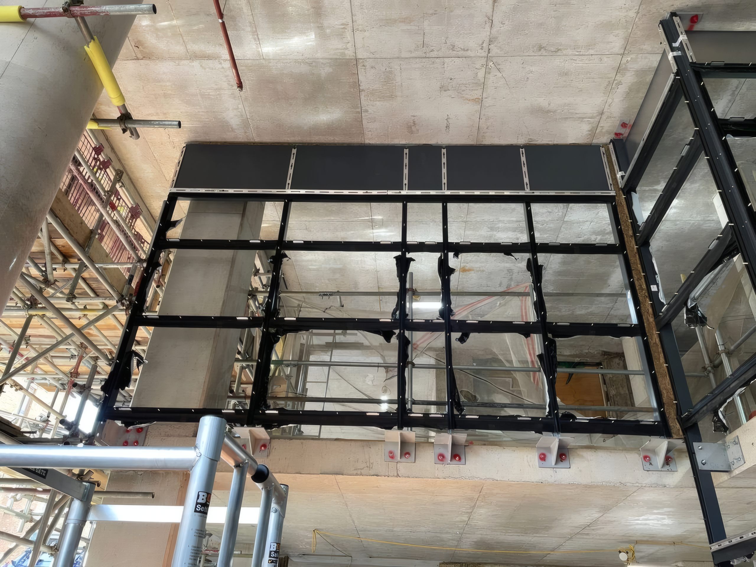 Structural steelwork for the curtain wall grid.